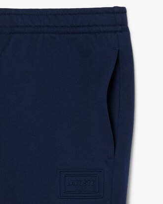 Pantal&oacute;n de ch&aacute;ndal con detalles de marca estampados en relieve
