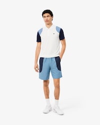 Pantal&oacute;n corto deportivo hidr&oacute;fugo con bloques de color