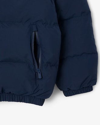 Chaqueta acolchada con capucha y cocodrilo bordado