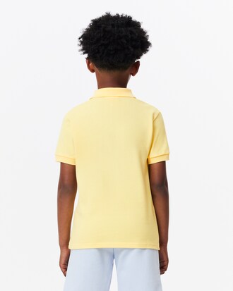 Polo Lacoste x Club Med en petit piqué avec badge