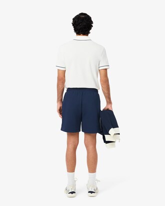 Short Tennis Héritage Ultra Dry badge