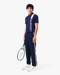 Pantalon de surv&ecirc;tement Tennis griff&eacute;
