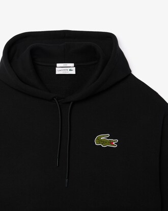 Sweatshirt à capuche loose fit avec badge
