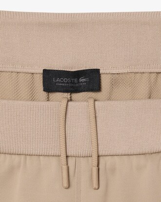 Pantalon de surv&ecirc;tement satin&eacute; loose fit D&eacute;fil&eacute;