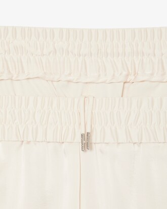 Pantalon fluide à poches zippées