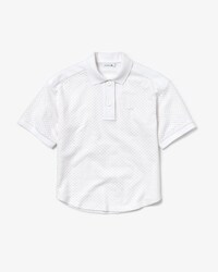 Polo court Lacoste en broderie anglaise et piqu&eacute;