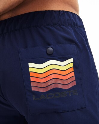 Short de bain stretch uni avec poches et logo vagues