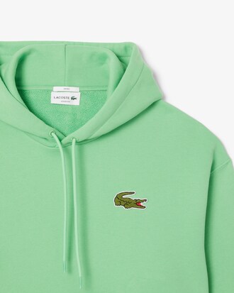 Sweatshirt à capuche loose fit avec badge
