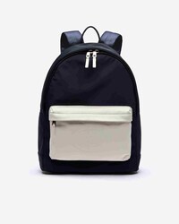 Sac à dos L.12.12 bicolore poche en cuir et marquage embossé