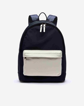 Sac à dos L.12.12 bicolore poche en cuir et marquage embossé