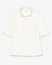 Polo Lacoste en petit piqu&eacute; uni avec dos pliss&eacute;