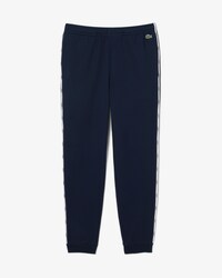 Pantalon de surv&ecirc;tement liser&eacute;s griff&eacute;s