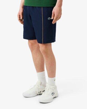 Shorts sportivi con bordo decorativo in taffet&agrave; a rombi