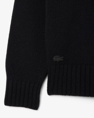 Maglione in lana cardata con marchio intarsiato