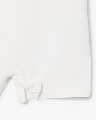 Tutina neonato in piqu&eacute; elasticizzato