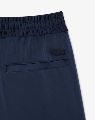 Pantaloni fluidi con tasca e zip