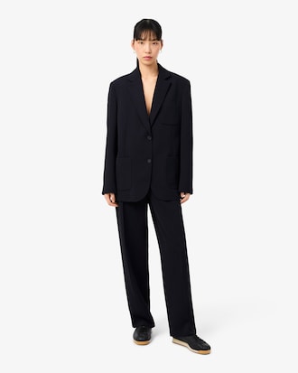 Pantaloni da abito oversize in piqu&eacute; fluido