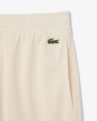 Shorts in mesh grafico