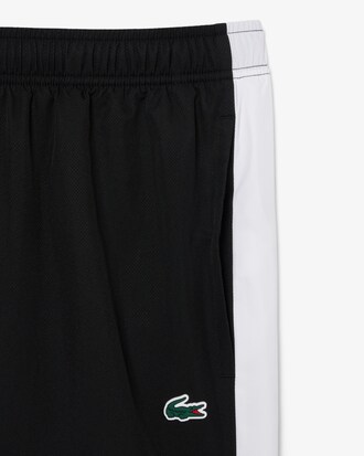 Shorts sportivi con banda in taffet&agrave; a rombi