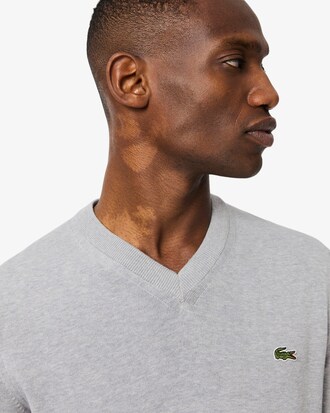 Maglione monocromatico in cotone con scollo a V