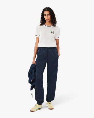 Pantaloni fluidi con tasca e zip