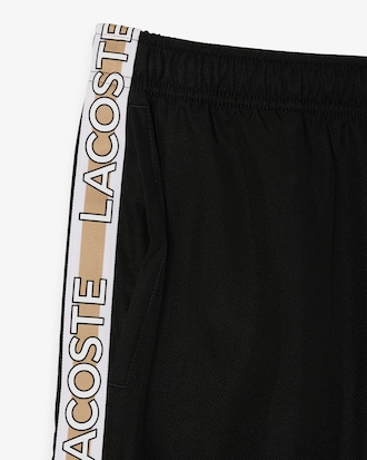 Shorts sportivi a righe con logo
