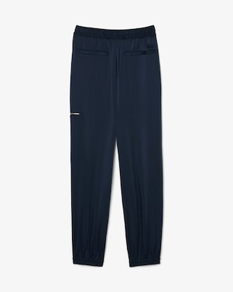Pantaloni fluidi con tasca e zip