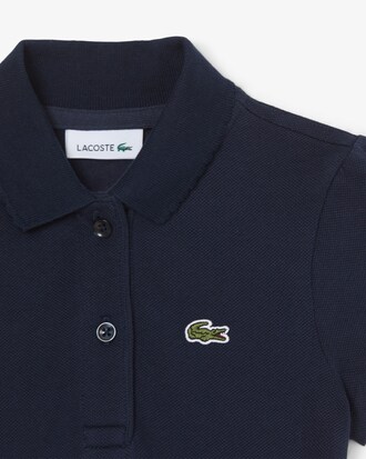 Polo in piqu&eacute; con collo smerlato