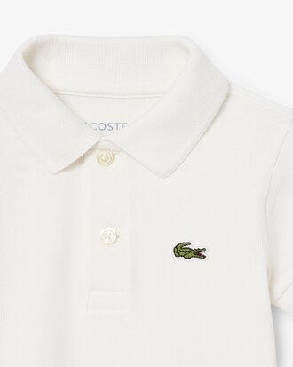 Tutina neonato in piqu&eacute; elasticizzato