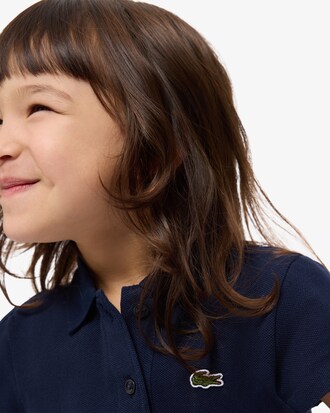 Polo in piqu&eacute; con collo smerlato