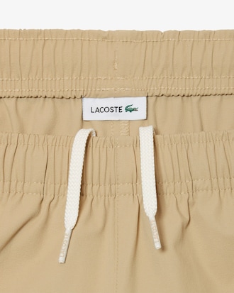 Shorts in taffetà con inserto in mesh