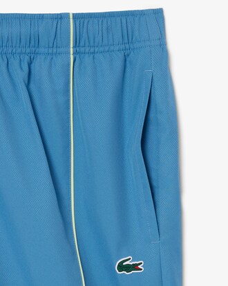 Shorts sportivi con bordo decorativo in taffet&agrave; a rombi