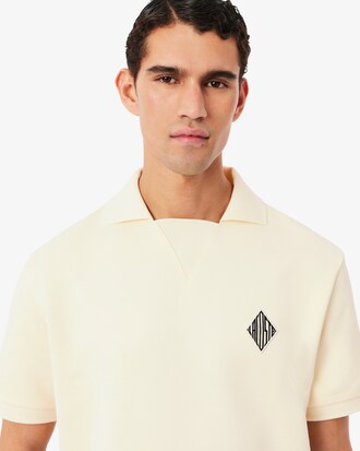 Polo loose fit in tessuto felpato con stemma
