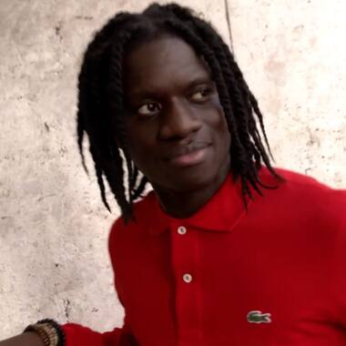 Salif wearing red polo