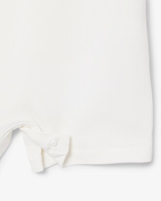 Tutina neonato in piqu&eacute; elasticizzato