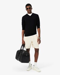 Maglione con scollo a V monocromatico in lana merino