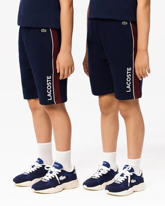 Shorts in pile con righe a contrasto
