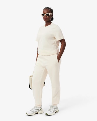 Pantaloni in tessuto felpato con logo goffrato