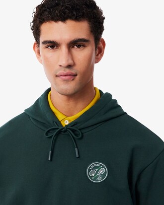 Felpa con cappuccio in tessuto felpato con stemma