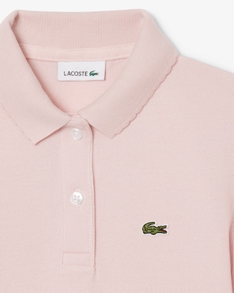 Polo in piqu&eacute; con collo smerlato