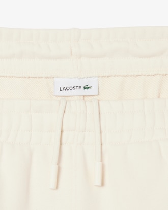 Pantaloni in tessuto felpato con logo goffrato