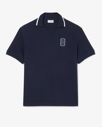 Polo loose fit in piqu&eacute; con stemma ricamato
