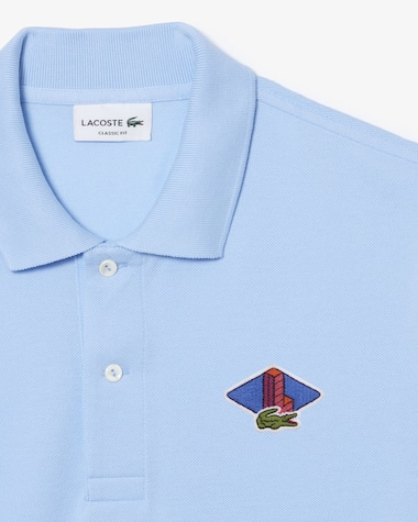 Polo Lacoste Original L.12.12 avec le badge gagnant Monogram Challenge Lacoste